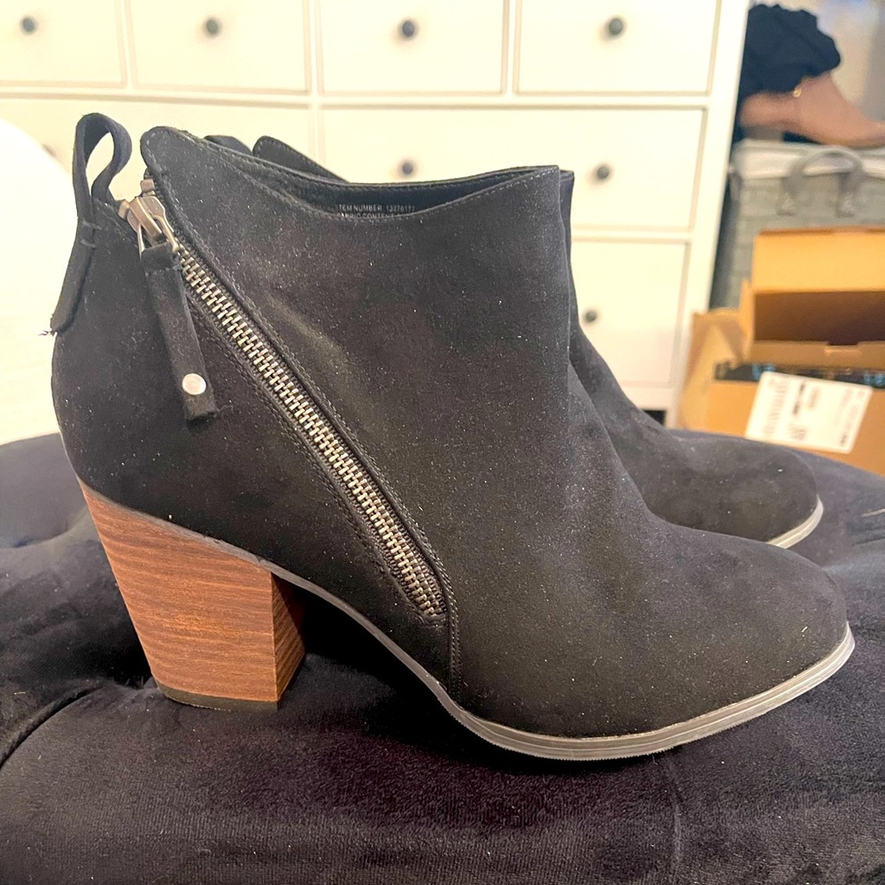 Suede like booties with a brown heel.